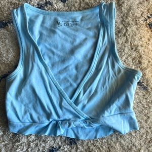Cropped blue tank top hardly worn with ruffles very soft material